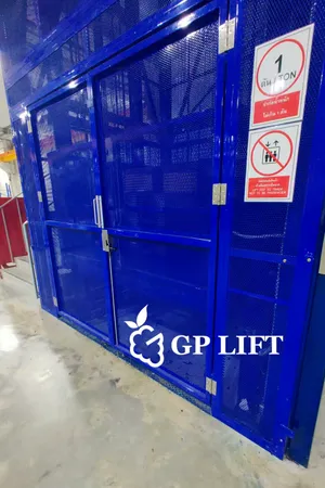 Blue full mesh cargo lift indoor warehouse project