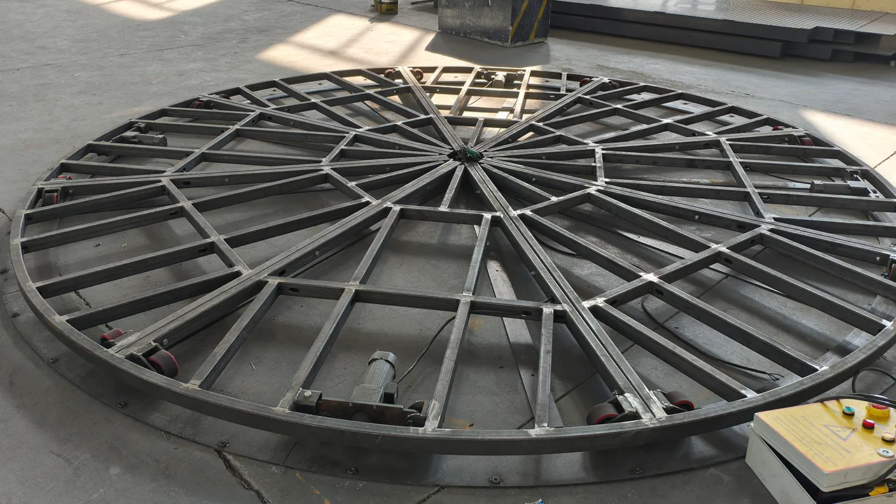 Bare steel frame of rotating car turntable under construction